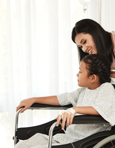 Mother with child in wheelchair