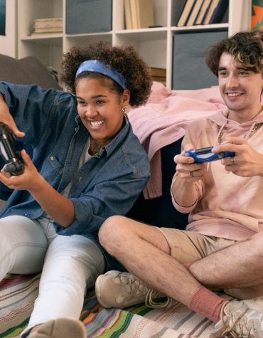 Teens playing Nintendo.
